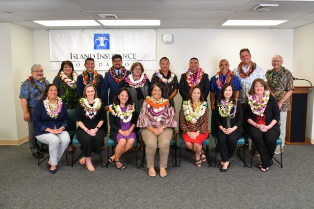 Principals Award finalists smiling with lei on